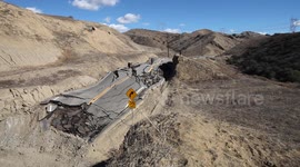 Landslide buckles road in California (wide view) V19294