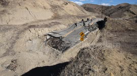 Landslide buckles road in California (wide view) V19295
