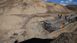 Landslide buckles road in California (wide view) V19298