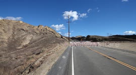 Landslide buckles road in California V19306