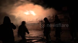 Homes burn after shelling as fighting intensifies on the outskirts of Donetsk, Ukraine