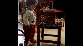Cute Baby sees for first time Saint Claus