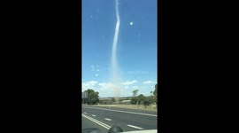 Whirlwind blows along Australia road