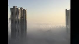 High-rise residents lost in the smog in Beijing,China