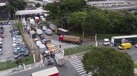 Drone footage of intense traffic at CEAGESP in Sao Paulo, Brazil