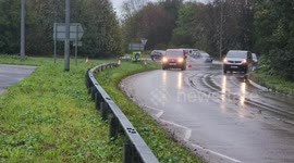 Van hits road cone in Flooding on the A27 at Lewes, Sussex after heavy rain