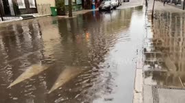 Flooded street in Central London following heavy rain