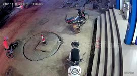 Cyclist slips into manhole after cover knocked off by passing truck