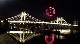 Guy Fawkes fireworks splash fountains of light over Chelsea Bridge, London