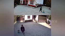 Father runs to stop baby walker with son inside from rushing down slope in China