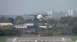 Dramatic moment plane at Birmingham Airport tips violently towards runway during strong winds