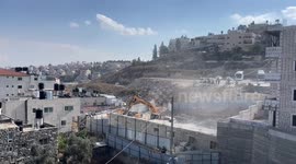 Israeli forces demolish a house of Palestinian in the East Jerusalem neighborhood of Beit Hanina