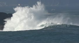 Strong waves crash against sea wall in Spain's San Sebastian