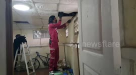 Officers catch monitor lizard hiding in family's ceiling