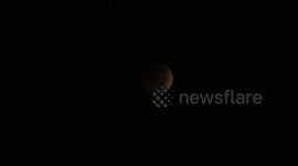 Lunar eclipse sees moon turn blood-red