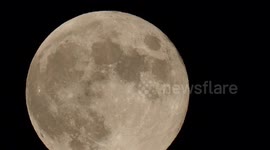 Stunning full Beaver Moon rising into night sky above Kent, UK