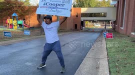 Poll worker entertain voters who head to the polls in Memphis