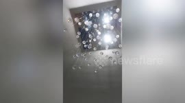 Hanging lights shake as earthquake rocks Italy