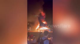 Buddhist pagoda set ablaze by sky lantern during religious festival in northern Thailand