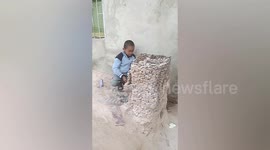 Creative 9-year-old uses crushed stones to build miniature building