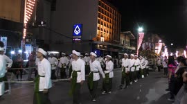 Dozens pull beautifully decorated chariot during festival of lights in Thailand