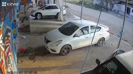 Sedan smashes through car wash walls in Thailand