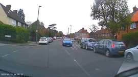 Car overtakes learner using the wrong side of road towards oncoming van.