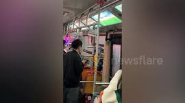 Passenger climbs out window after bus gets stuck in traffic