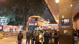 Londoners crowd at bus stops outside Euston station during evening rush hour of London Tube strike