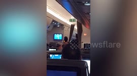 Passenger hauled off plane by police after yelling at flight attendant for bottle of water (extra angle)