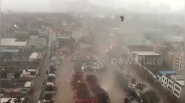 Sparks fly into sky as tornado tears through Chinese city (longer version)