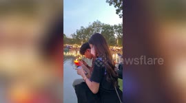 Devotees hair catches fire while whispering prayers with floating lantern
