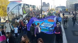 Thousands of climate activists cross Waterloo Bridge in London on Cop27 Global Day of Action