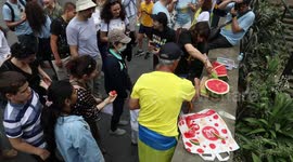 Ukrainians in Sydney celebrate the liberation of Kherson with watermelons, for which the city is known