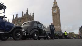 Hundreds of London Cab drivers line Westminster Bridge to give free lifts to veterans attending Remembrance Sunday ceremony