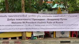 Russian protesters unfurl banner welcoming Vladimir Putin to APEC event in Bangkok