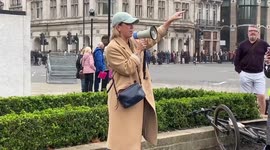 Hospitality sector protester cries during demonstration in London's Parliament Square