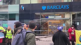 Climate activists smear Barclays windows with black paint in protest at bank's funding of fossil fuel industries