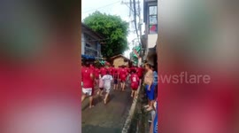 Residents hold wooden hut carrying race during festival in the Philippines