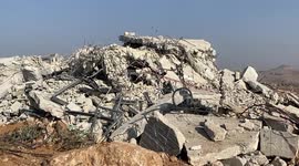 Palestinians inspect the rubble of houses which were demolished by the Israeli army