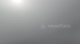 A Wind Farm Looming Over A Steppe Amid Clouds in Zhangjiakou, China