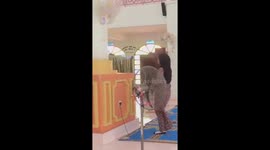 Not a fan! Worshipper in mosque has scary fall and trips on wire causing fan to fall on head