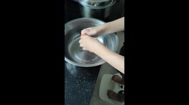 Toddler breaks eggs for the first time