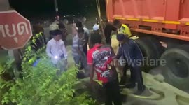 Rescuers use crane to hoist calf stuck in sewer drain for a week in Thailand