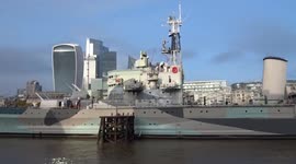Giant red poppy decorates London's HMS Belfast