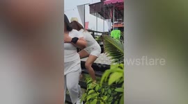 Woman wearing high heels slips falls gaps in steps outside restaurant