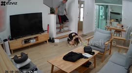 Woman slips on wooden stairs while wearing socks