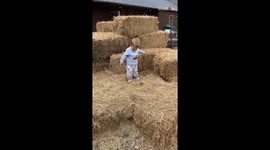 Toddler casually walking on straw slips through gap *Baby Fail!*