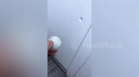 Golf ball flying into shop narrowly misses owner in China
