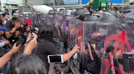 Protesters hurl paint at riot police amid anger at APEC summit in Bangkok, Thailand